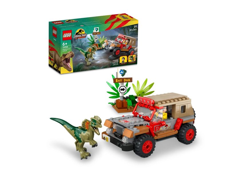 Everything included in the Lego Jurassic Park Dilophosaurus Ambush kit, next to its box.