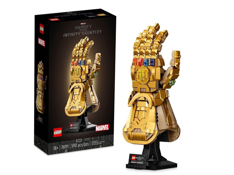 An assembled Lego Marvel Thanos Glove next to its box.