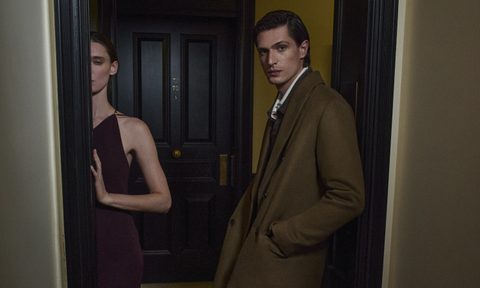 Man and woman in Vince holiday attire