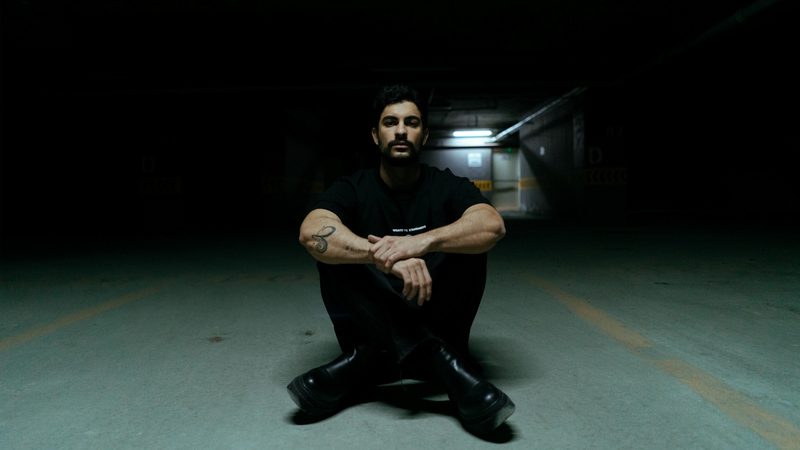 Man in all black on the ground