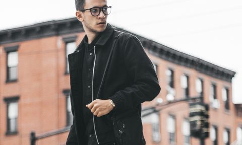 Man in all black walking