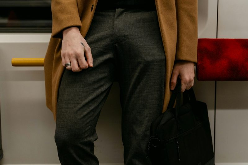 Man in gray pants and camelhair coat