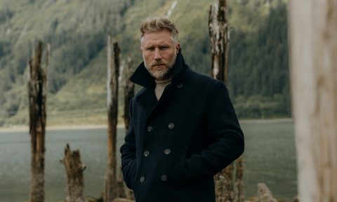 Man in the woods in Taylor Stitch Peacoat