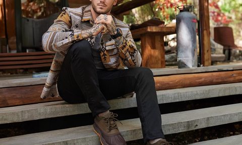 Man wearing outdoor and hiking boots from Skechers deals