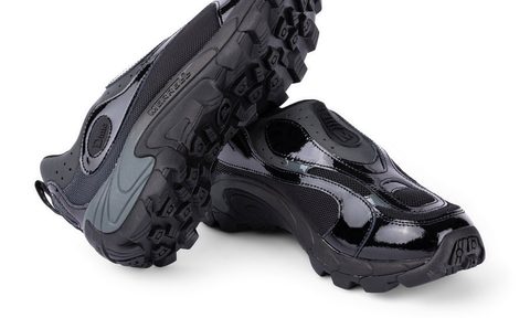 black sneakers on top of one another