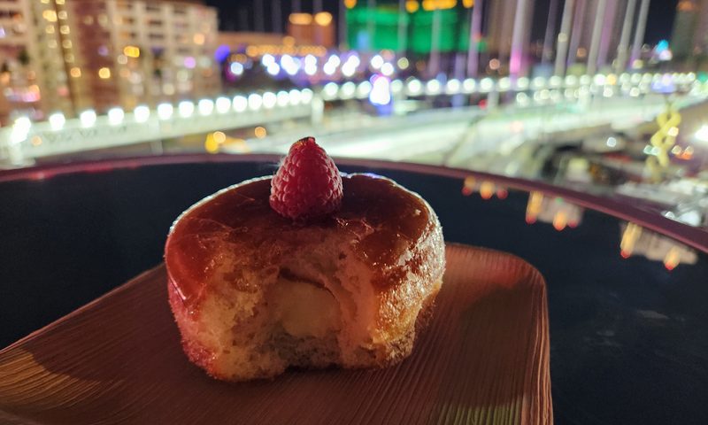 Most of ahand made creme brulet donut from one of the many food booths in the Paddock Club.
