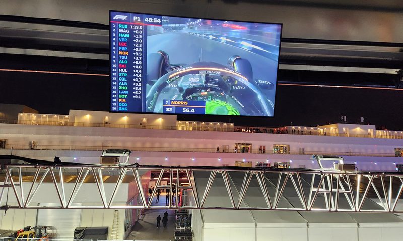 One of the giant screens visible from the Turn 3 Club rooftop.