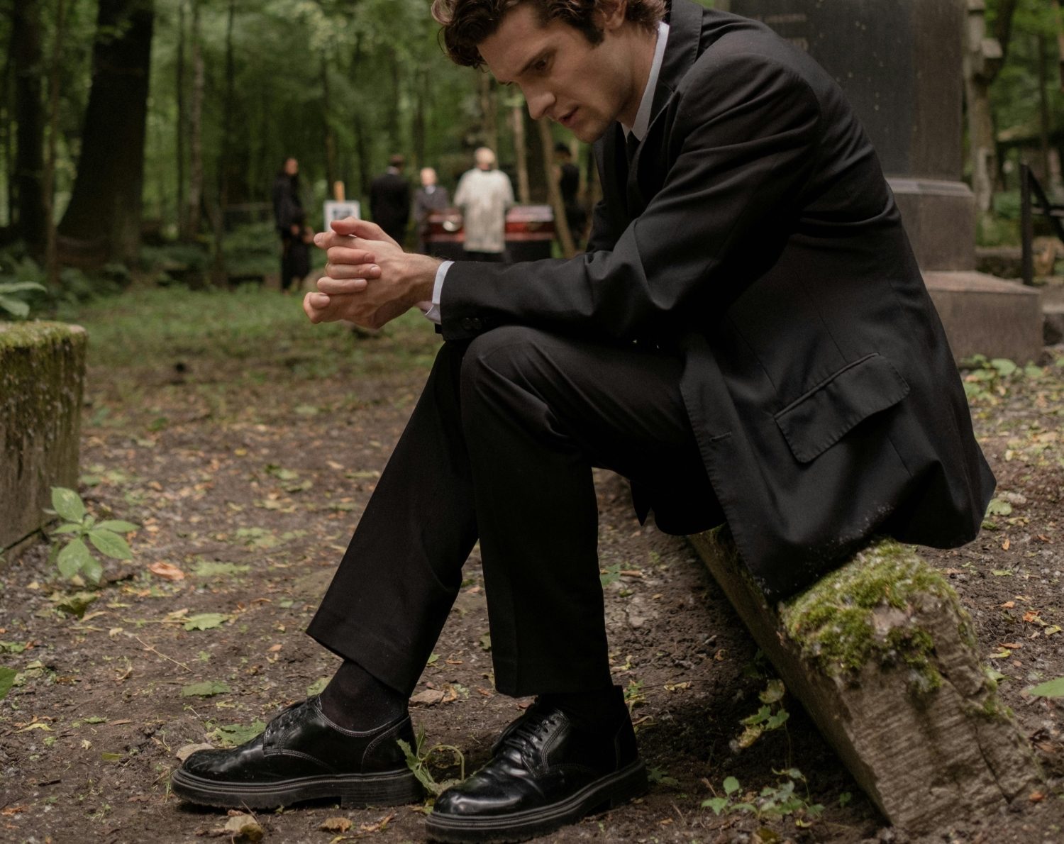 Sad man sitting outside