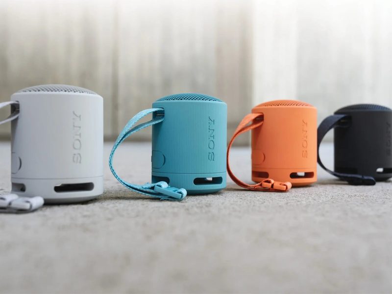 A lineup of Sony XB100 compact Bluetooth speakers in various colors.