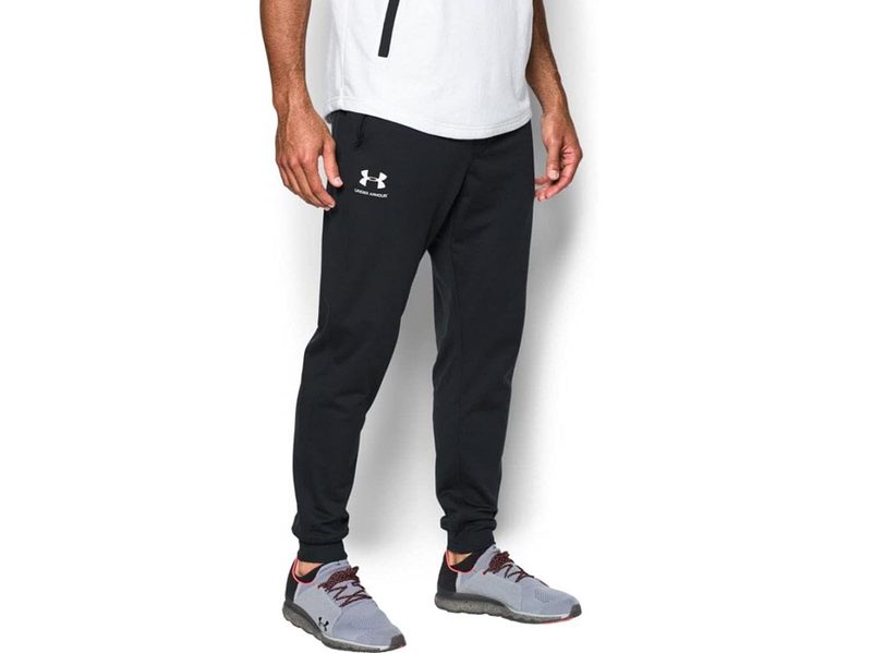 A model wearing the Under Armour Men's Sportstyle Tricot Joggers.