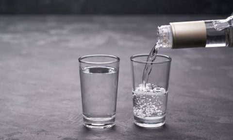 Vodka pouring in a glass