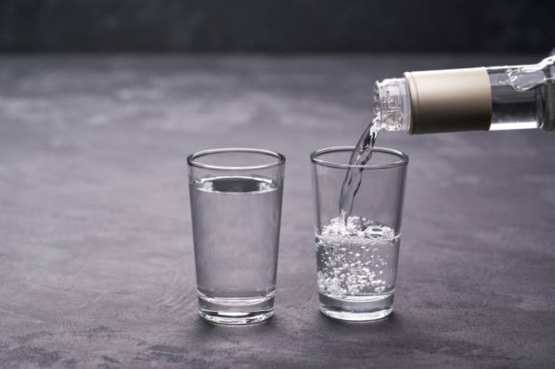 Vodka pouring in a glass