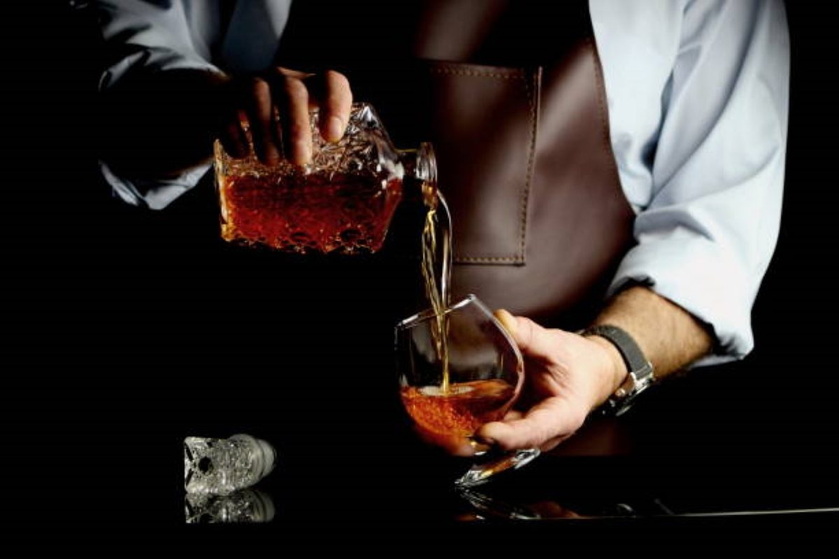 Pouring whiskey in a glass