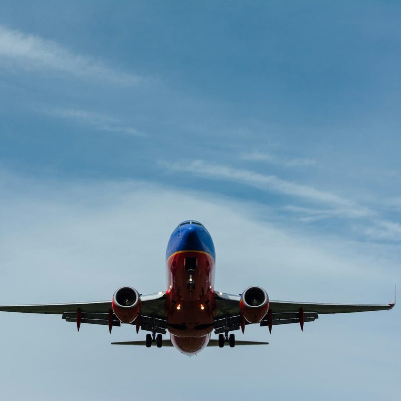 Blue and red airplane in the sky