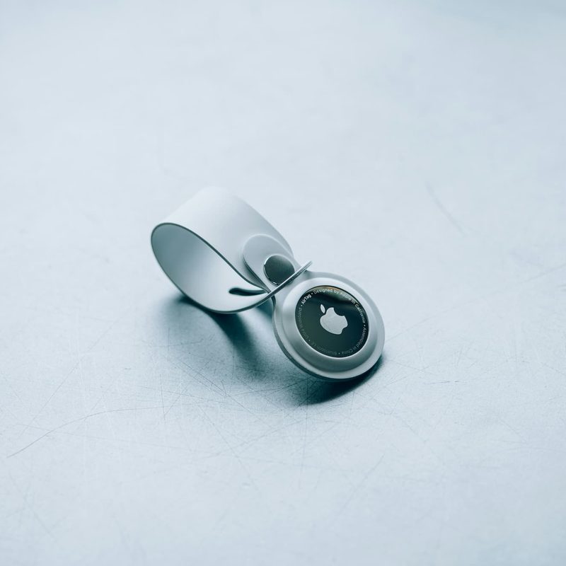 Apple AirTag on white table