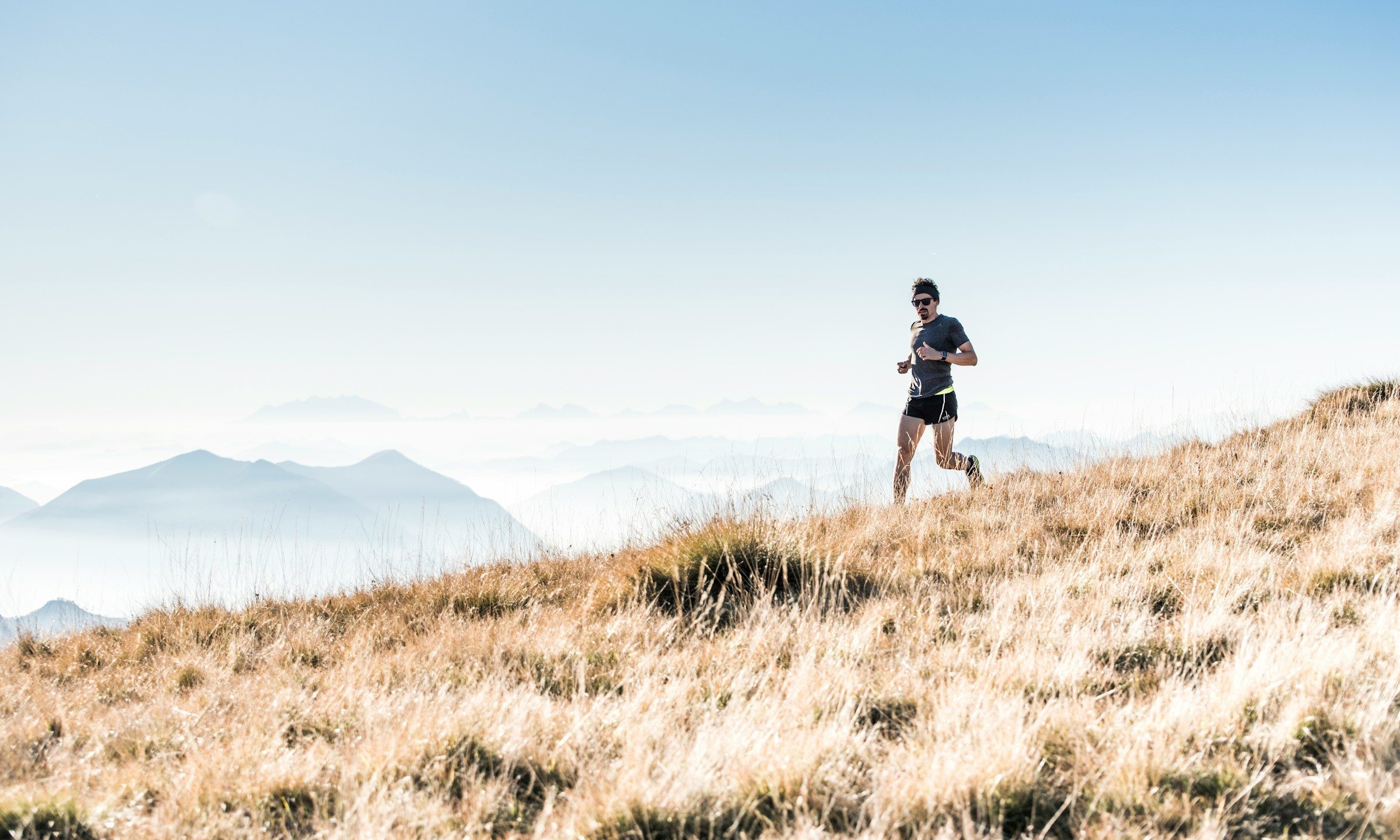 man running on mountain outside