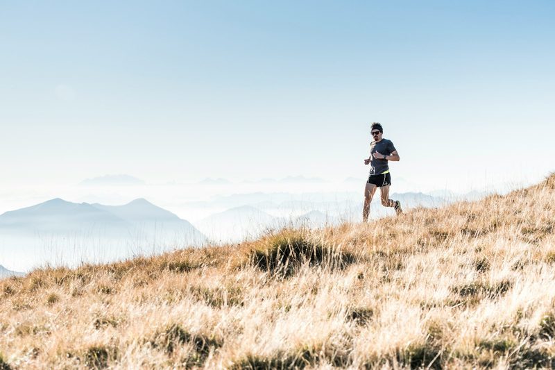 man running on mountain outside