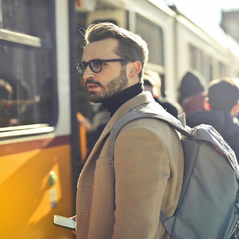 Getting on the train wearing a backpack