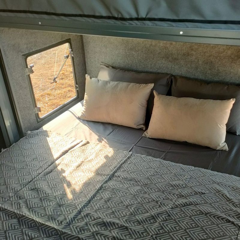 Sleeping quarters inside BERG Off-Road's CX off-road travel trailer
