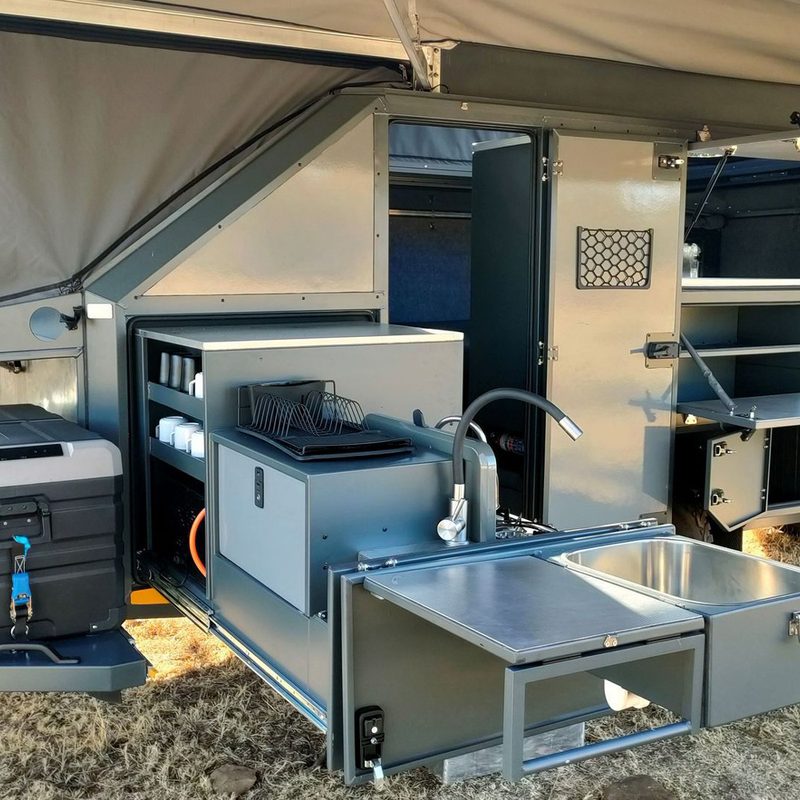 Massive outdoor kitchen attached to BERG Off-Road's CX3 overlanding trailer