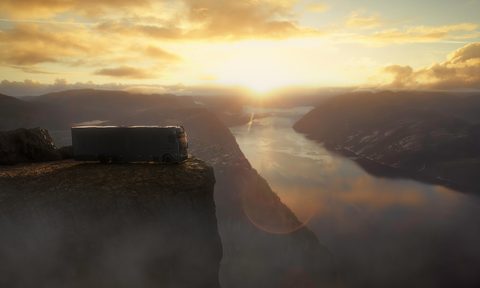 Rendering of a Brabus Big Boy 1200 luxury motorhome parked on a cliff overlooking a river.