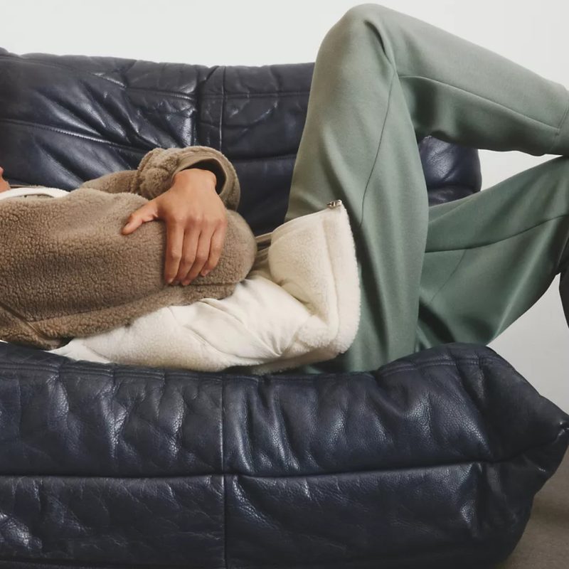 A pair of lululemon sweatpants on a reclining man