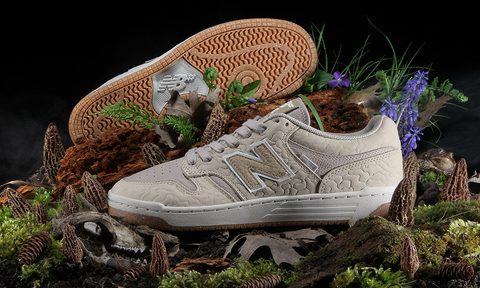 mushroom new balance sneakers sitting among leaves