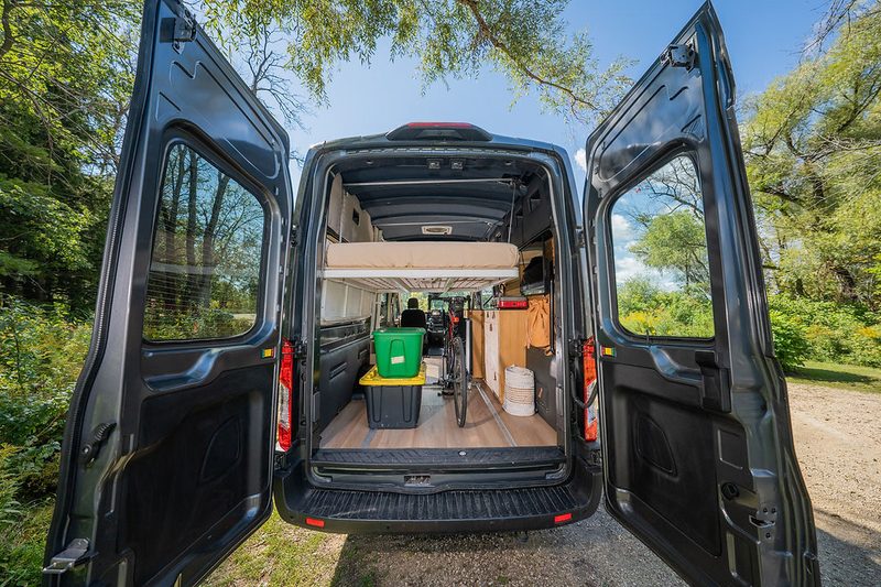 Sleeping quarters/rear storage area inside the Orion 365 Ford Transit camper van.