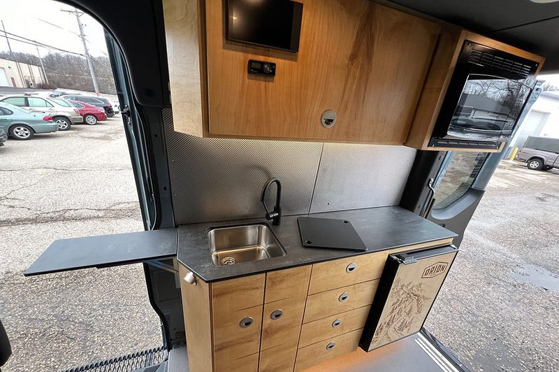 Kitchen inside an Orion 365 Ford Transit camper van.