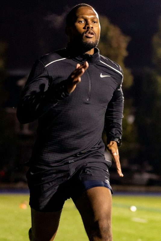 man exercising at night working out running outdoors high intensity dark nighttime