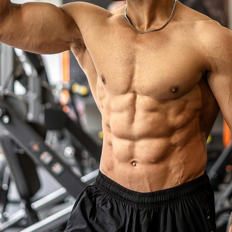 shirtless muscular man muscle in gym