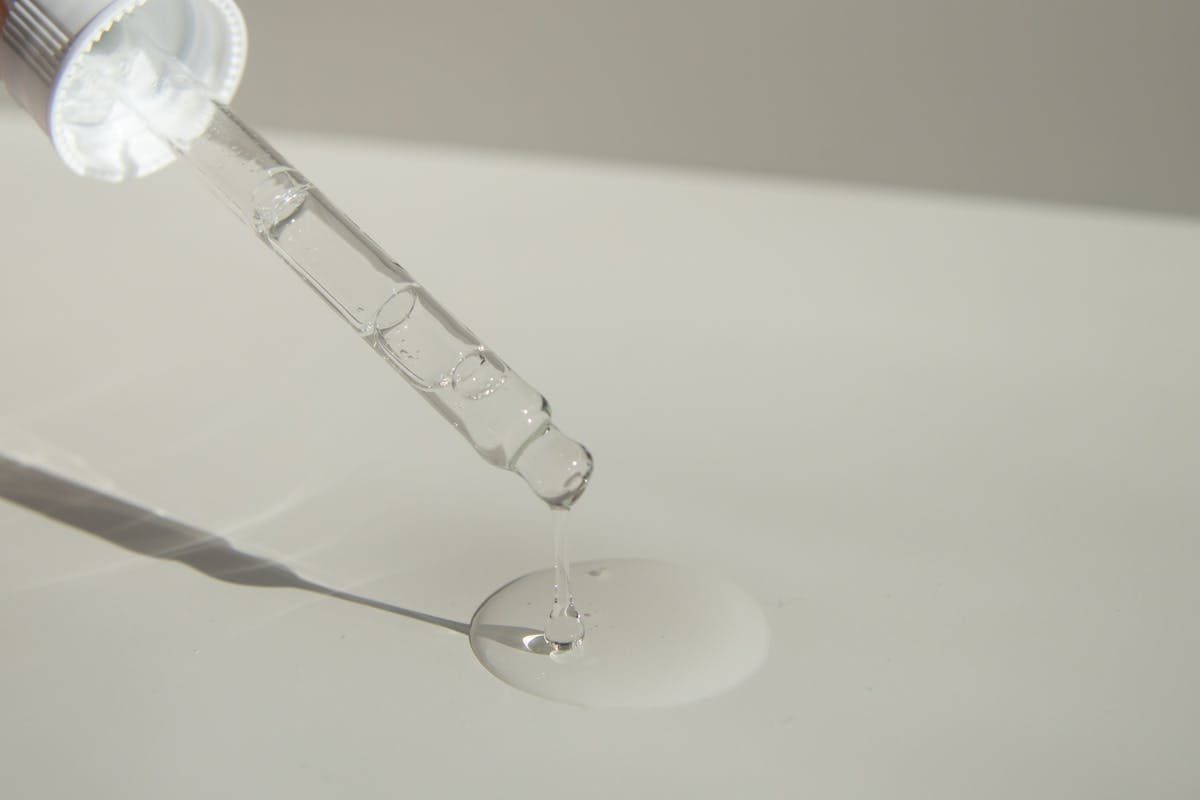 a person applying serum to a countr