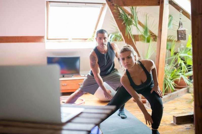at home workout exercise man and woman class stretch yoga