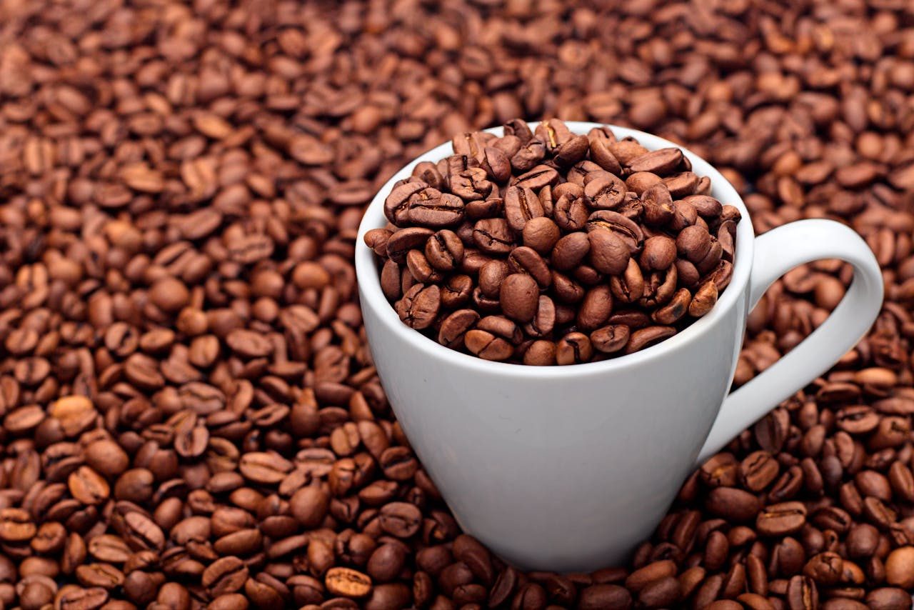 Cup of whole bean coffee