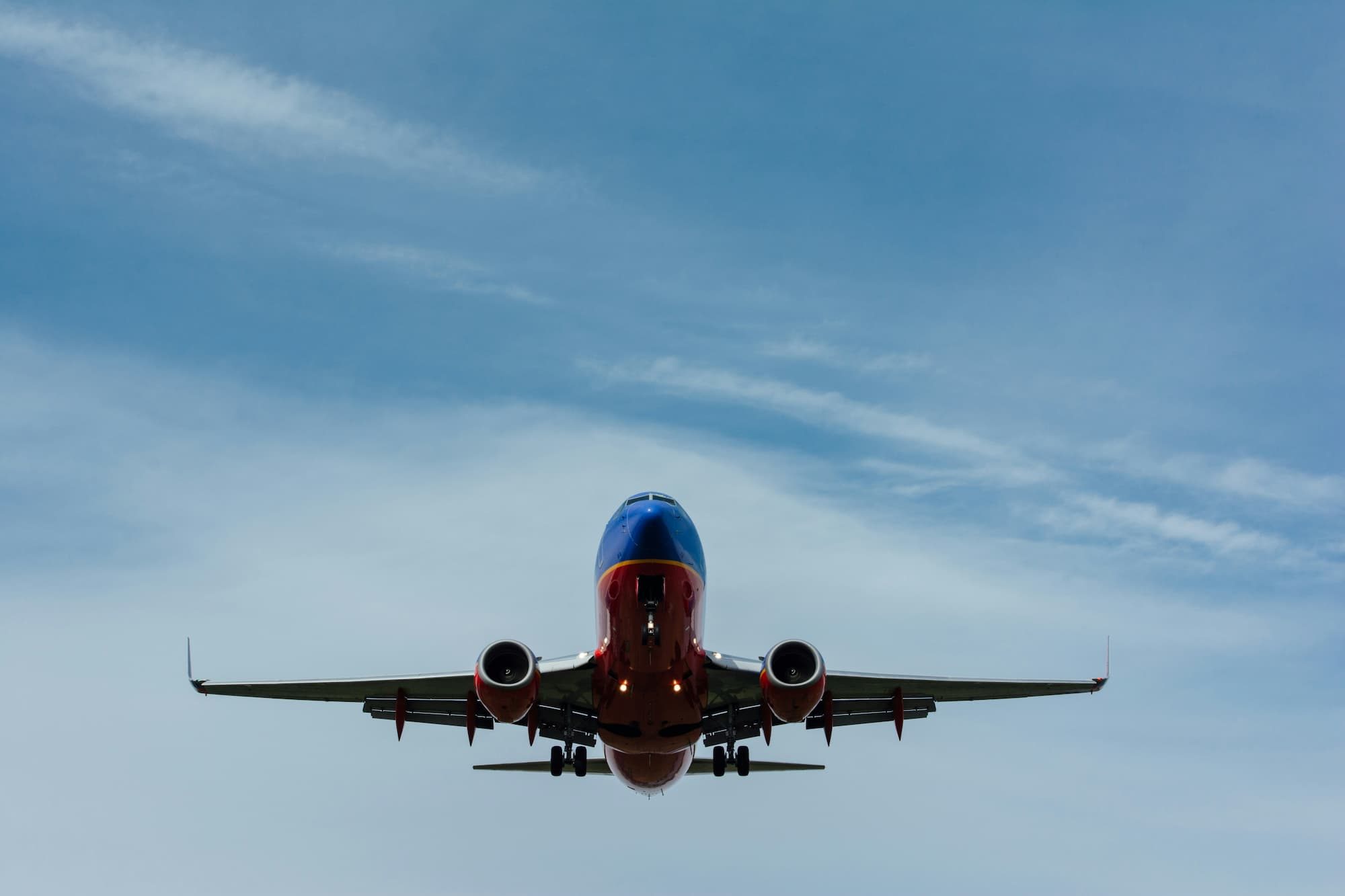 airplane flying in blue sky