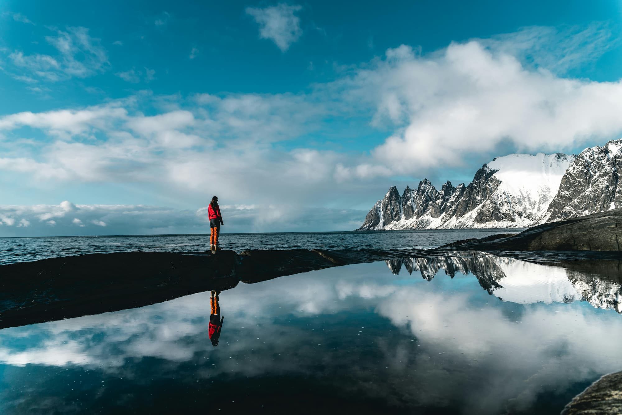 person standing outside near body of water