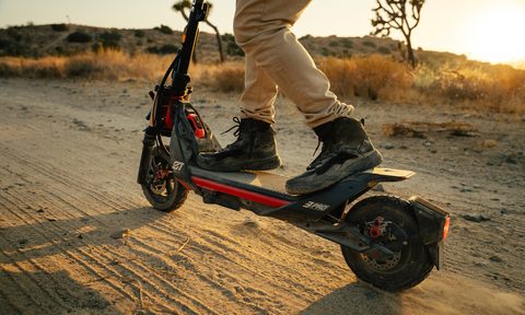 Closeup of rider on a desert trail on a Segway ZT3 Pro electric scooter