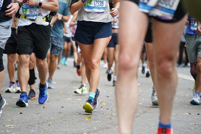 marathon runners legs on road