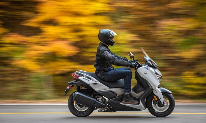 2024 Yamaha XMAX scooter right profile with upright rider posture.