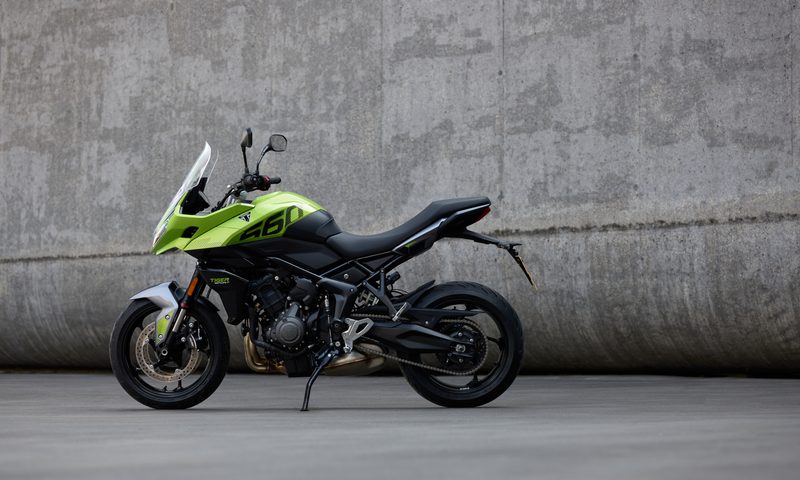 2025 Triumph Tiger Sport 660 left profile view against a cement wall.