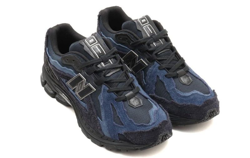 navy blue and black sneakers against white background