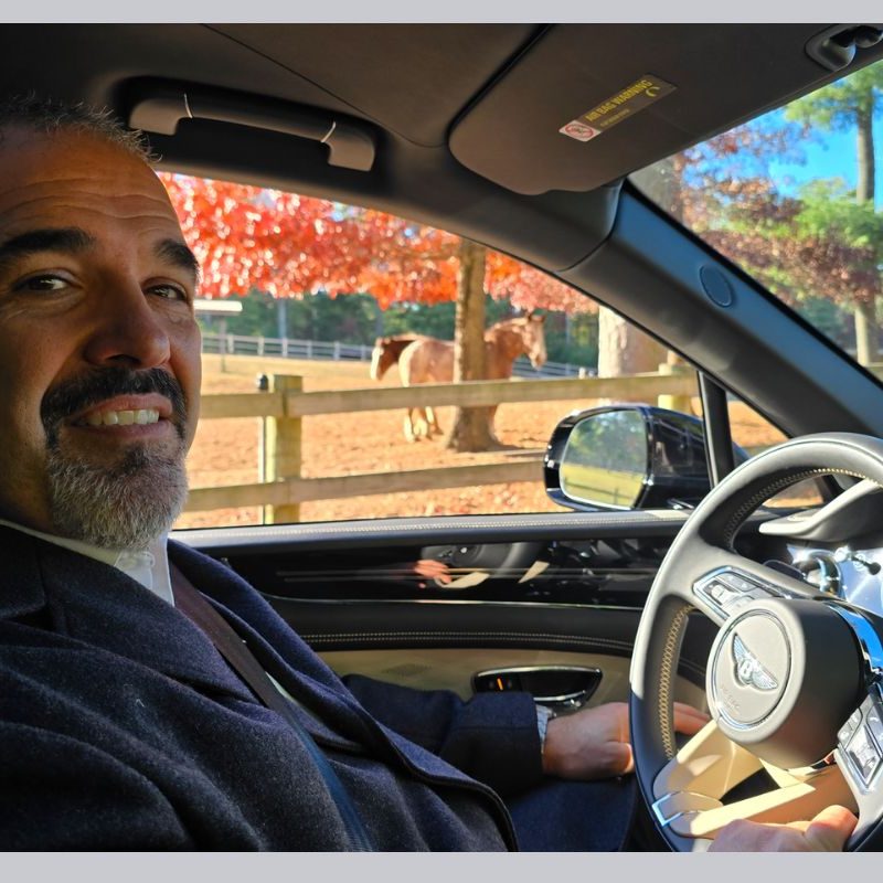 Staff member Norman showing us The Preserve RI in a Bentley