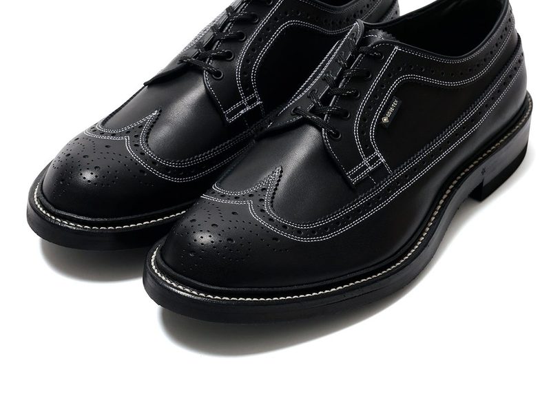 black wingtip shoes with white contrast