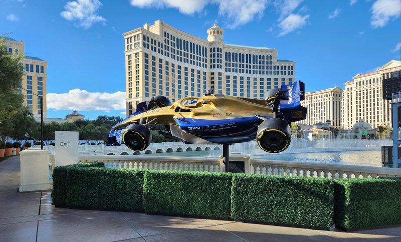 A model F1 race car suspended on the walkway around the lake at the Bellagio.