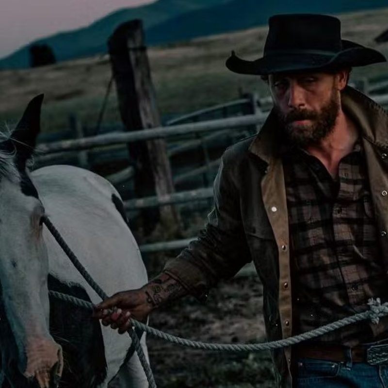 Filson Jacket leading a horse