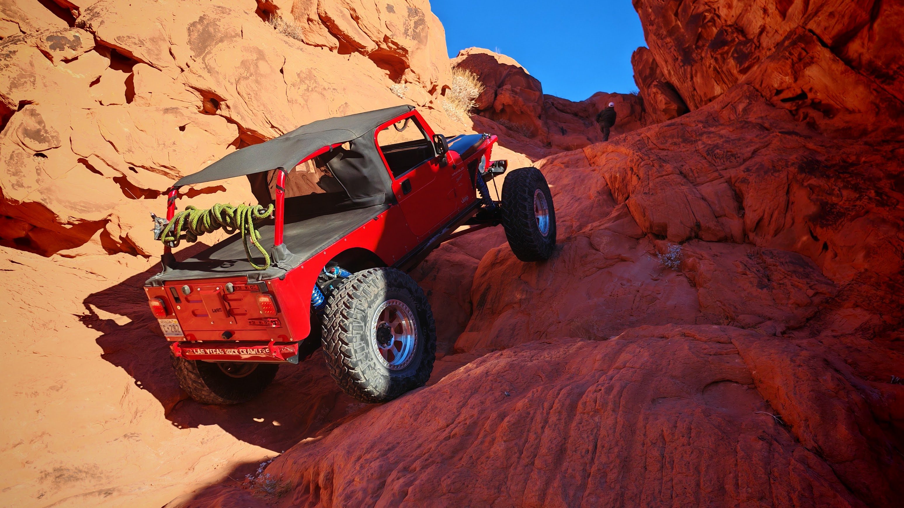Jeep rock crawling over boulders