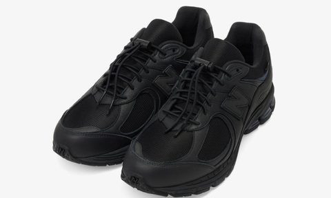 overhead view of two black New Balance sneakers