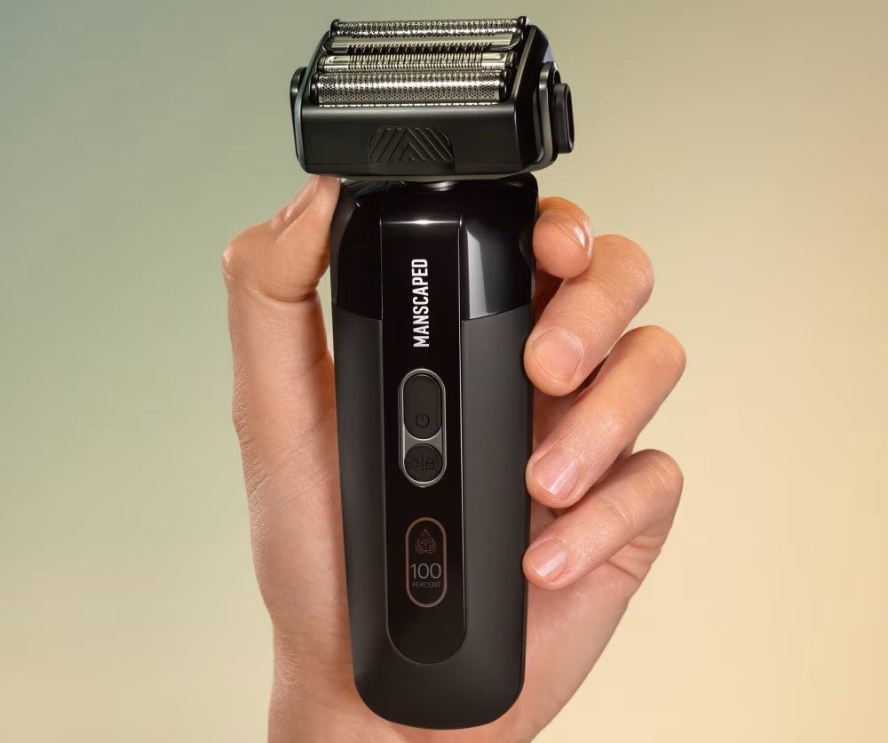 Manscaped Chairman Pro electric foil shaver in hand