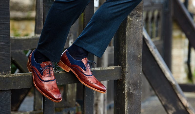 man wearing red and blue oxford shoes with wingtip