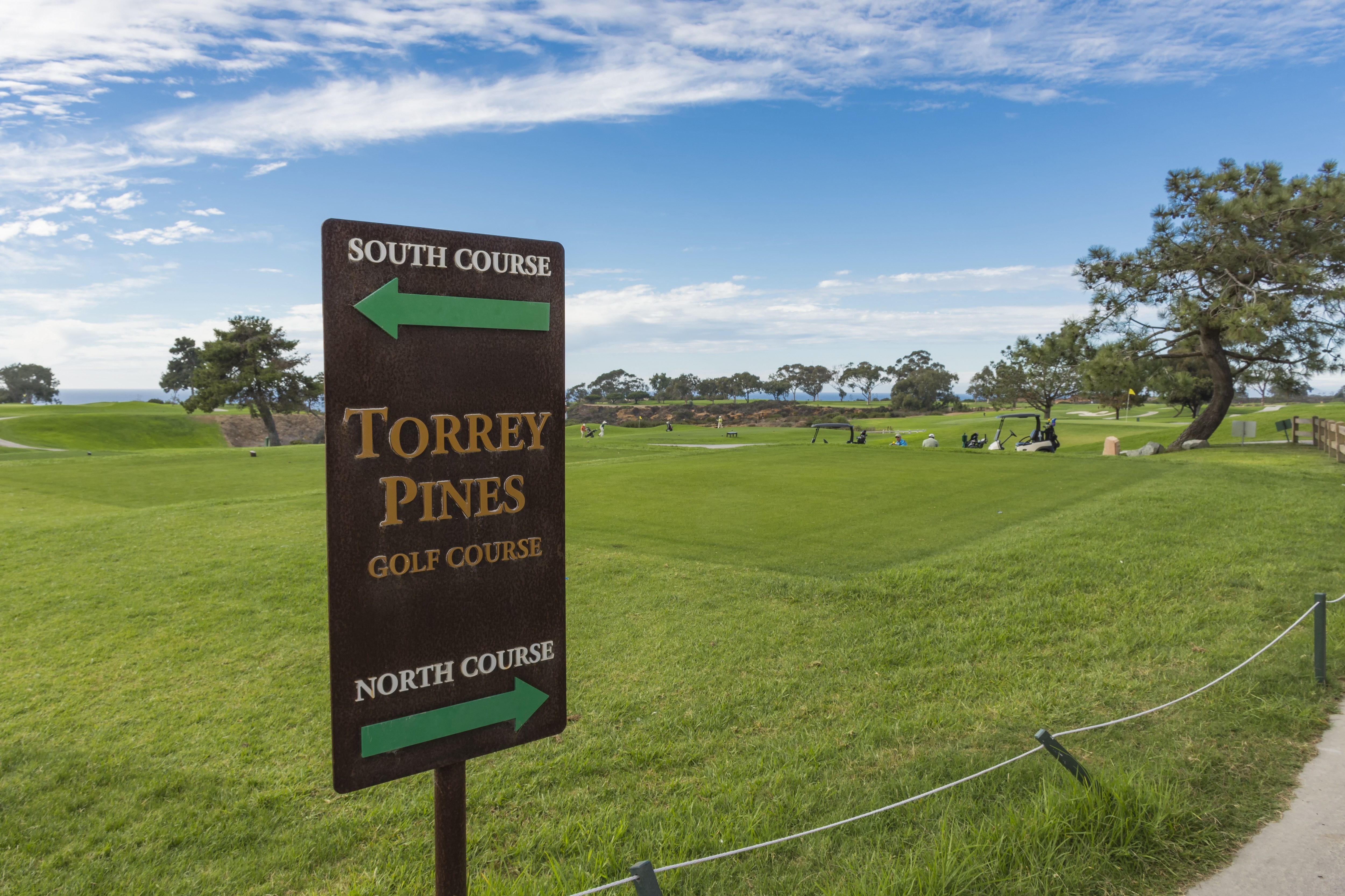 The North Course and South Course sign on the first tee of Torrey Pines golf course near San Diego.